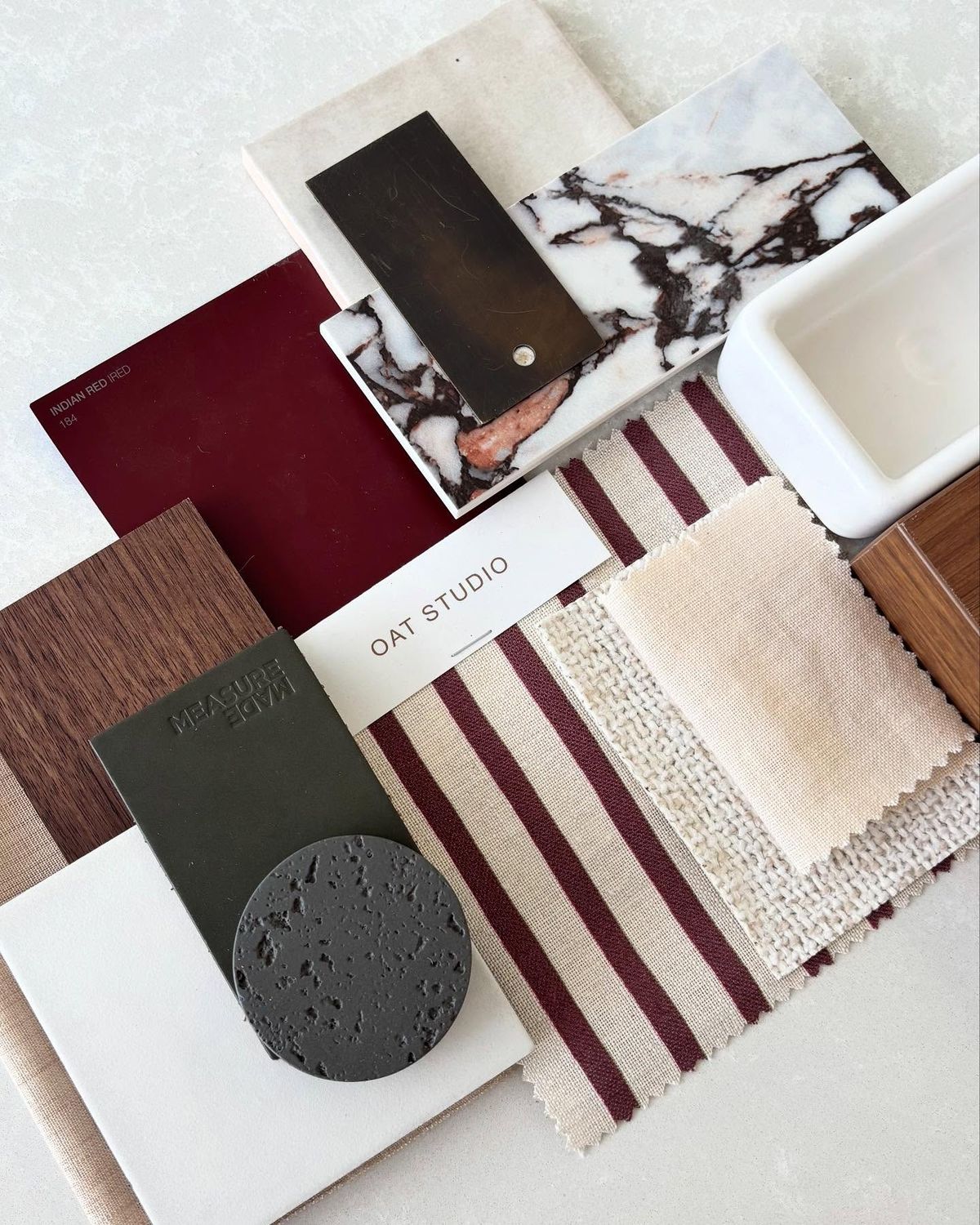 Interior material palette with marble, textile and wood samples